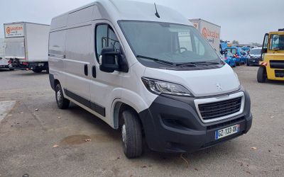 a white van that is parked in a parking lot