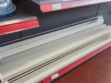 a lot of empty shelves in the store for sale