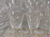 a lot of glasses that are sitting on a table