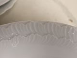 a close up of a white plate on a table