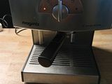 an image of a coffee machine on a wooden table