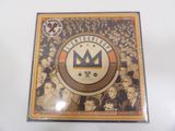a close up of a cd with a crown on top of it