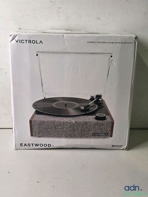 an image of a record player in a box on a table