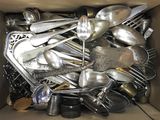 a box full of silver spoons and spoons in it