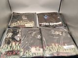 a black box full of t - shirts that are sitting on top of each other