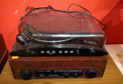 a radio that is sitting on top of a wooden table