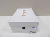 a white box that has a gold logo on it