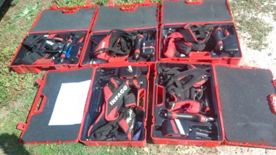 many tools in the red cases on the ground