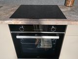 a black stove top oven sitting on top of a counter