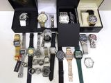 a lot of watches that are sitting in a box