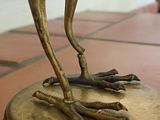 a statue of a bird that is on top of a table