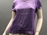 the mannequin is wearing a purple shirt and khaki pants