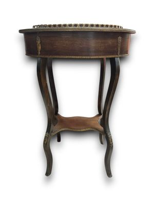 the table is made of wood and has a metal top