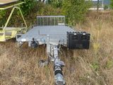 a trailer that is sitting in the middle of a field