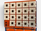 an orange and white box with a lot of holes on it