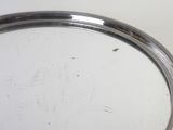 a silver tray with a silver handle on a table