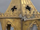 an antique brass lantern with a cross on the top of it