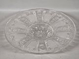 a clear glass bowl with a flower design on it