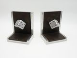pair of metal dice bookends on a white background