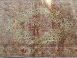an image of a rug on the ground with a cat laying on it