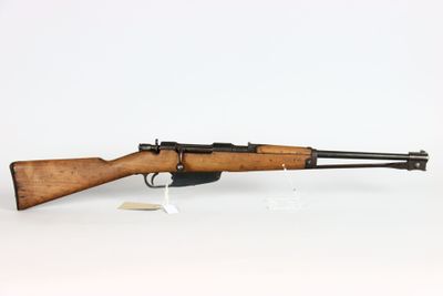 a rifle with a wooden barrel on a white background