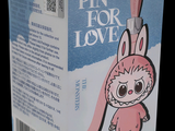 a pink box with a cartoon bunny holding a pair of scissors
