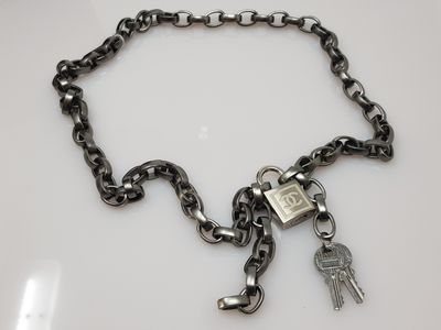 a chain with a padlock and two keys attached to it