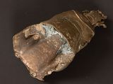 a small piece of pottery that is on a black surface