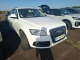 several white cars parked in a parking lot next to each other