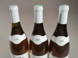 three bottles of wine sitting next to each other on a table