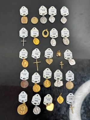 a lot of gold and silver coins in a display case