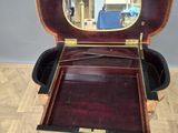 a wooden box with a mirror in it on a wooden floor