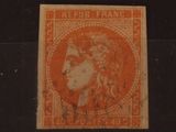 un timbre orange sur lequel figure l'image d'une femme