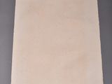 an image of a square piece of paper on a gray surface