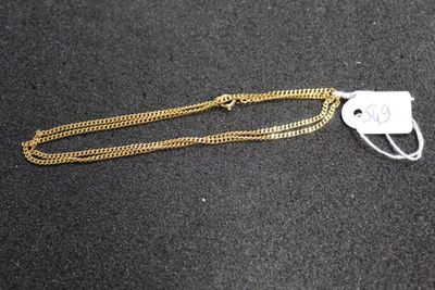 a close up of a gold chain with a tag on it