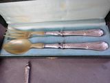 a silverware set in a box with a spoon and a fork