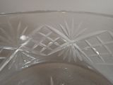 a clear glass bowl with a design on it