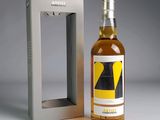 an image of a bottle of alcohol sitting next to a box