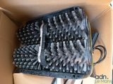 a box with a bunch of brushes inside of it