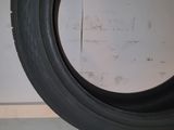 a close up of a tire on a shelf in a room