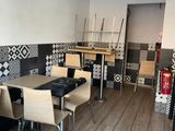 a table and chairs in the corner of a room
