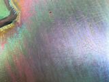 a close up of a colorful vase on a table