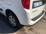a white van that is parked on the side of the road