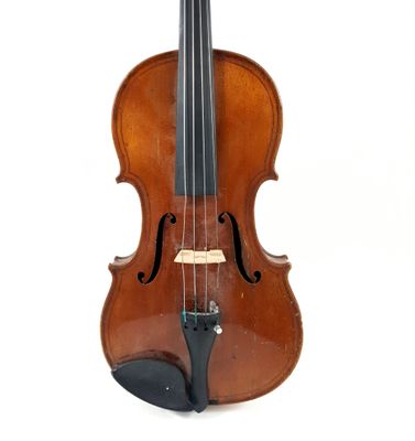 an old violin sitting on a white surface with a white background