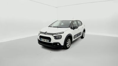 a white citrole is parked in a white room