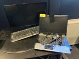 a laptop computer sitting on top of a desk next to a monitor