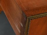 a close up of a wooden desk with a drawer underneath it