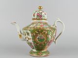 an image of a green and pink teapot with a gold lid
