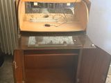 a small desk with a computer on top of it