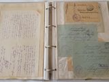 an open book with a lot of papers inside of it